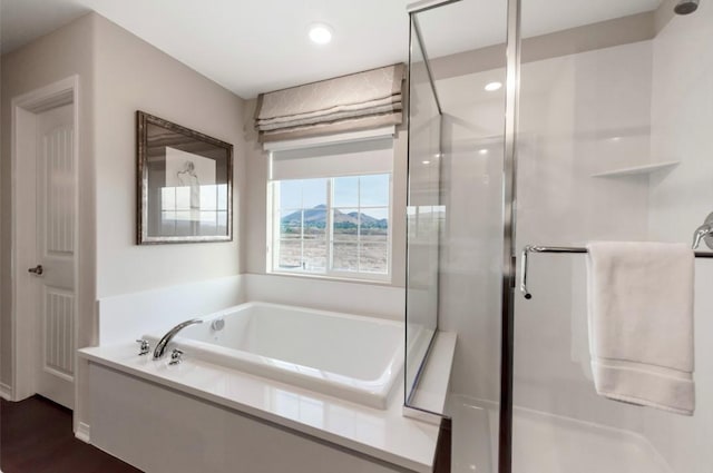 11829 Confluence Dr, Jurupa Valley, CA 91752 - full bathroom with a shower stall, a bath, recessed lighting, and wood finished floors
