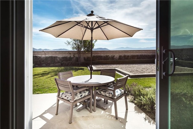 11829 Confluence Dr, Jurupa Valley, CA 91752 - view of patio / terrace with outdoor dining space and a mountain view