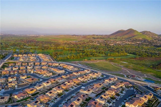 11829 Confluence Dr, Jurupa Valley, CA 91752 - aerial view at dusk of a residential view and a mountain view