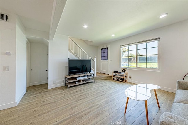 68 Timber Run Unit 45, Irvine, CA 92614 - living room featuring stairway, light wood-type flooring, and recessed lighting