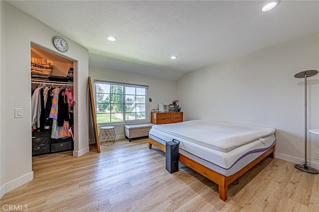68 Timber Run Unit 45, Irvine, CA 92614 - bedroom featuring light wood-type flooring, recessed lighting, and a walk in closet