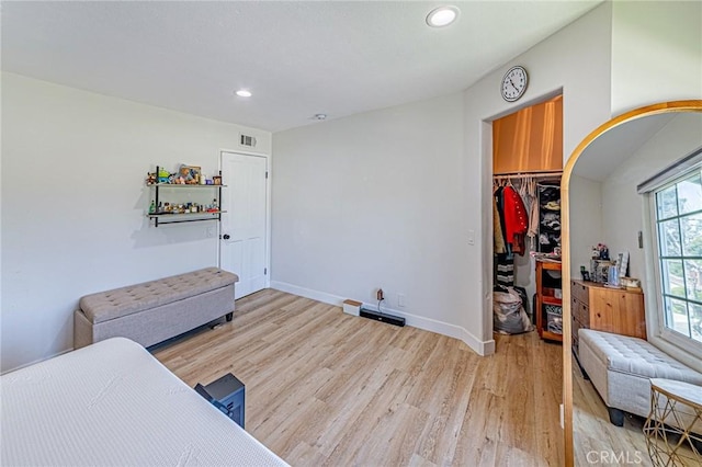 68 Timber Run Unit 45, Irvine, CA 92614 - bedroom with light wood-style flooring, recessed lighting, and a walk in closet