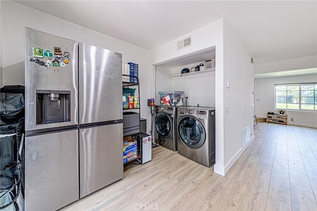 68 Timber Run Unit 45, Irvine, CA 92614 - laundry area featuring washer and dryer and wood finished floors