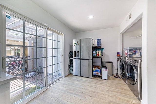 68 Timber Run Unit 45, Irvine, CA 92614 - laundry room featuring light wood-type flooring, washer and clothes dryer, and recessed lighting