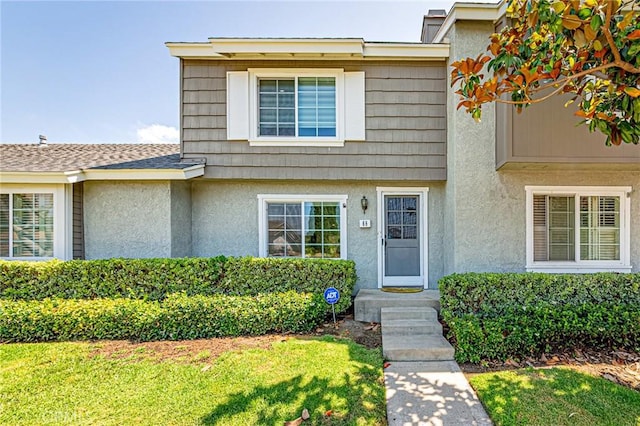 68 Timber Run Unit 45, Irvine, CA 92614 - view of front of property with stucco siding