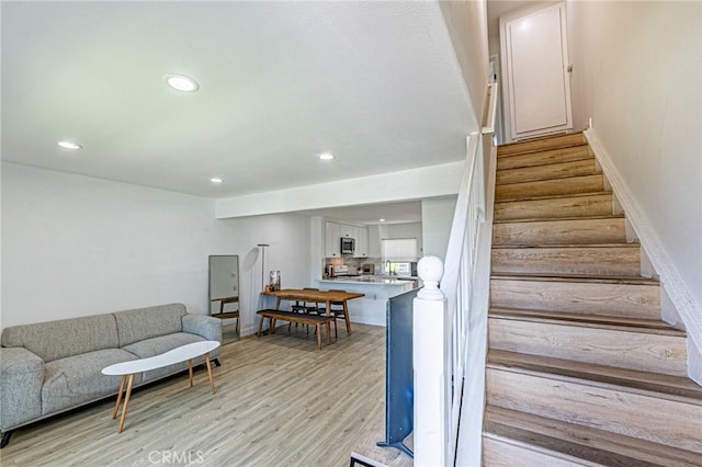 68 Timber Run Unit 45, Irvine, CA 92614 - staircase featuring recessed lighting and wood finished floors
