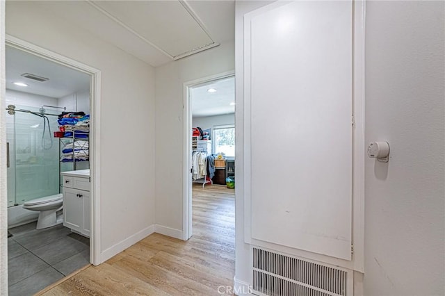 68 Timber Run Unit 45, Irvine, CA 92614 - hall featuring attic access and light wood-style floors