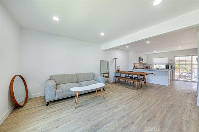 68 Timber Run Unit 45, Irvine, CA 92614 - living room with light wood finished floors and recessed lighting