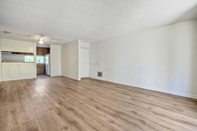 6180 Agee St Unit 159, University City, CA 92122 - unfurnished living room with a textured ceiling, light wood-style floors, and a ceiling fan