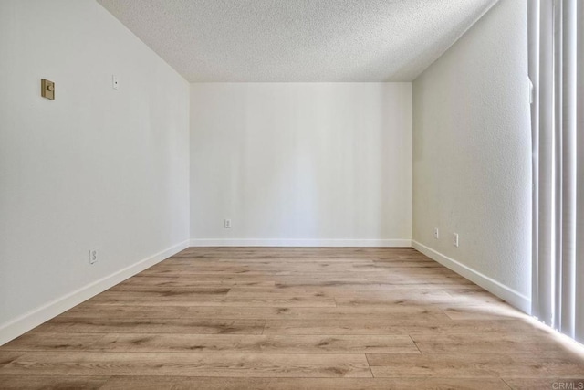 6180 Agee St Unit 159, University City, CA 92122 - additional living space featuring a textured ceiling and light wood-style floors