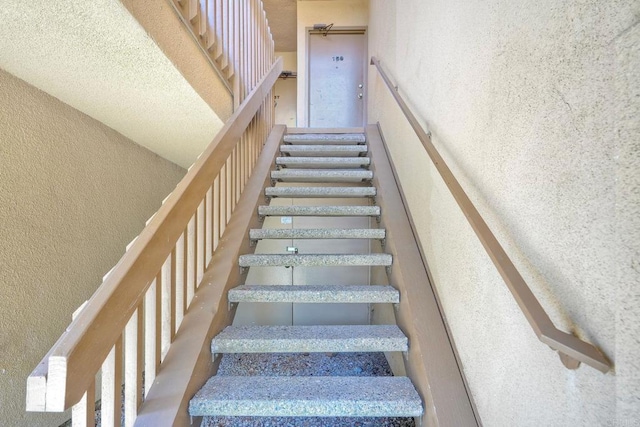 6180 Agee St Unit 159, University City, CA 92122 - staircase with a textured wall