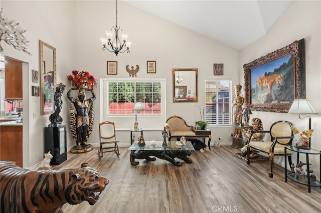 44505 Shadowcrest Dr, Lancaster, CA 93536 - living area featuring wood finished floors, a chandelier, and high vaulted ceiling