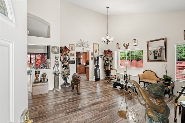 44505 Shadowcrest Dr, Lancaster, CA 93536 - living area featuring high vaulted ceiling, wood finished floors, and a chandelier