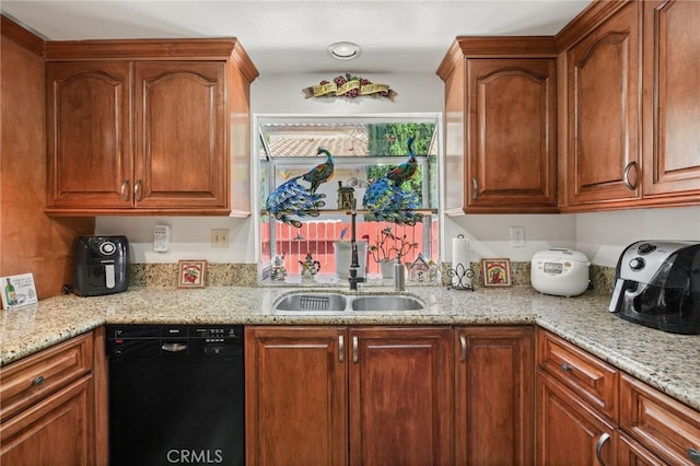 44505 Shadowcrest Dr, Lancaster, CA 93536 - kitchen featuring dishwasher, light stone counters, and brown cabinets