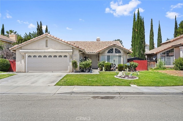 44505 Shadowcrest Dr, Lancaster, CA 93536 - view of front of house featuring a chimney, a garage, concrete driveway, a tiled roof, and stucco siding