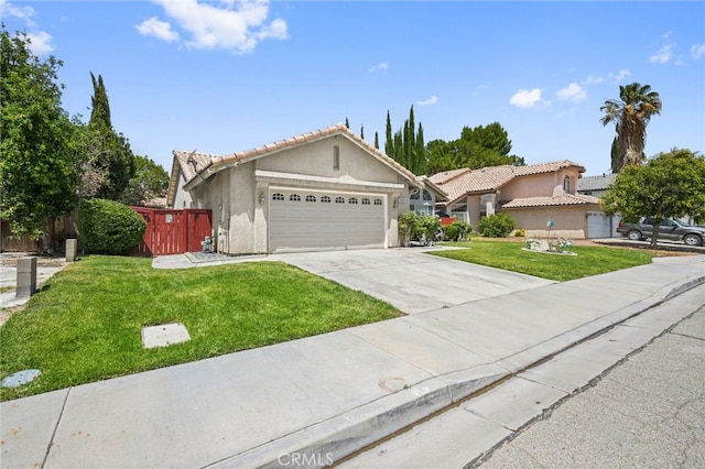 44505 Shadowcrest Dr, Lancaster, CA 93536 - view of front of property featuring an attached garage, stucco siding, driveway, and a tile roof