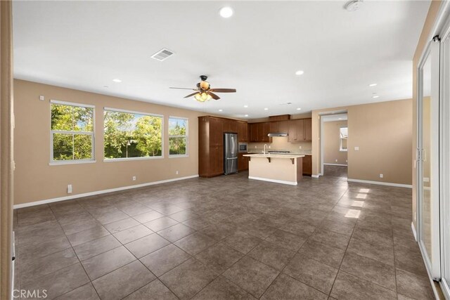 403 Sevilla Dr, Brea, CA 92823 - unfurnished living room featuring ceiling fan, recessed lighting, and dark tile patterned floors