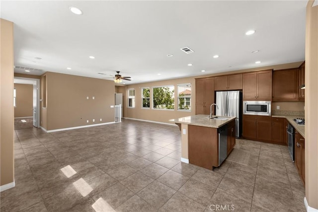 403 Sevilla Dr, Brea, CA 92823 - kitchen featuring stainless steel appliances, a ceiling fan, recessed lighting, a center island with sink, and open floor plan