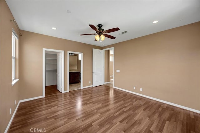 403 Sevilla Dr, Brea, CA 92823 - unfurnished bedroom featuring wood finished floors, a walk in closet, recessed lighting, a closet, and ceiling fan