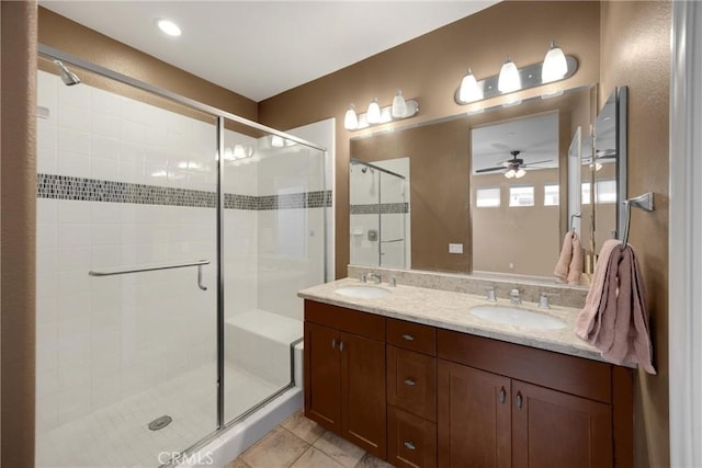 403 Sevilla Dr, Brea, CA 92823 - full bathroom featuring a shower stall, double vanity, ceiling fan, and tile patterned flooring