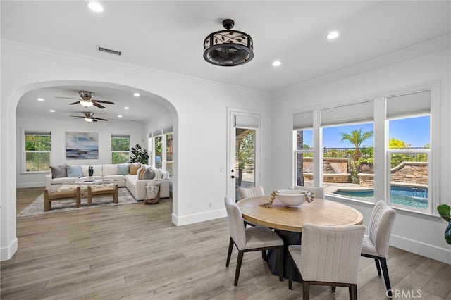 19 Dennis Ln, Ladera Ranch, CA 92694 - dining room featuring arched walkways, recessed lighting, light wood finished floors, ornamental molding, and ceiling fan