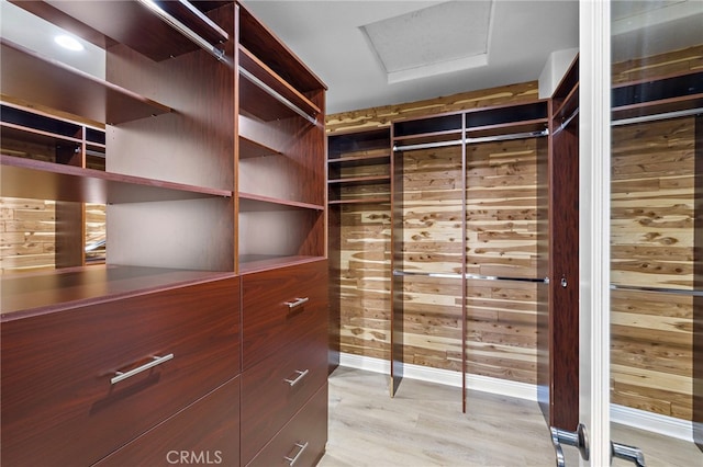 19 Dennis Ln, Ladera Ranch, CA 92694 - walk in closet featuring light wood-style flooring and attic access