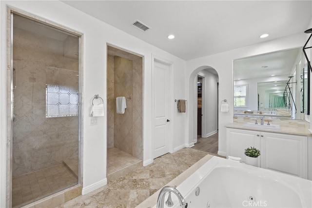 19 Dennis Ln, Ladera Ranch, CA 92694 - bathroom with a jetted tub, vanity, a tile shower, and recessed lighting