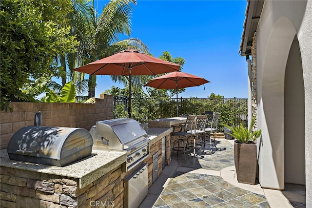 19 Dennis Ln, Ladera Ranch, CA 92694 - view of patio / terrace with exterior kitchen and a bar