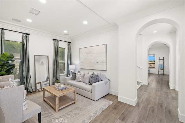 19 Dennis Ln, Ladera Ranch, CA 92694 - living area with arched walkways, light wood finished floors, recessed lighting, stairway, and ornamental molding