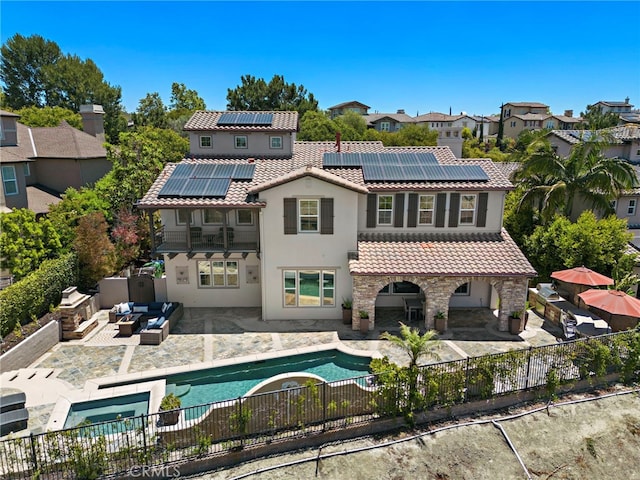 19 Dennis Ln, Ladera Ranch, CA 92694 - rear view of property featuring an outdoor living space, a tile roof, a fenced backyard, and roof mounted solar panels