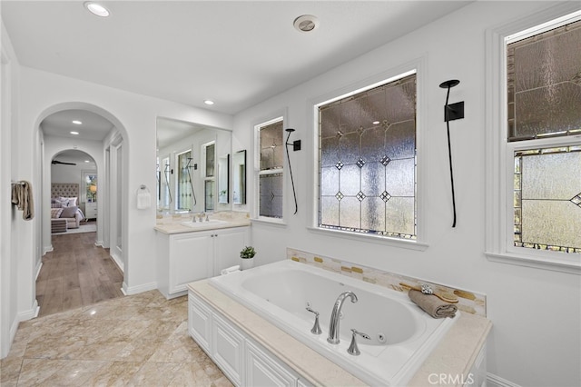19 Dennis Ln, Ladera Ranch, CA 92694 - ensuite bathroom featuring a jetted tub, vanity, and recessed lighting