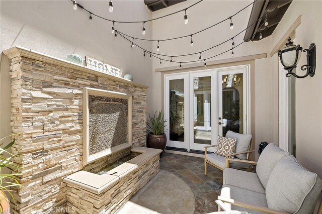 19 Dennis Ln, Ladera Ranch, CA 92694 - view of patio featuring french doors and a fireplace