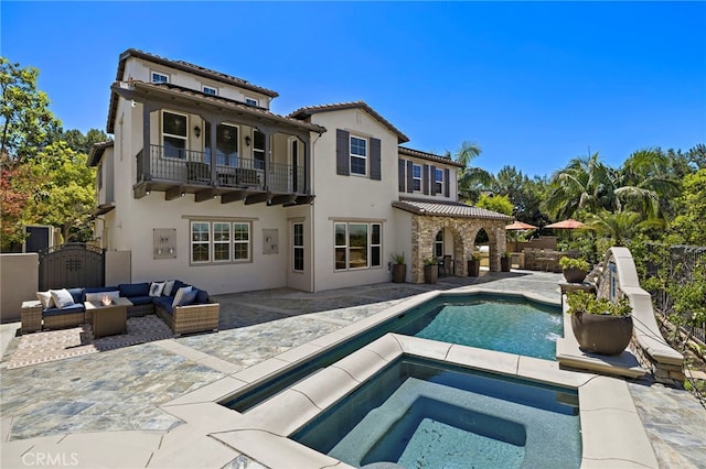 19 Dennis Ln, Ladera Ranch, CA 92694 - rear view of house featuring a balcony, an outdoor living space, an in-ground hot tub, a patio area, and a tiled roof