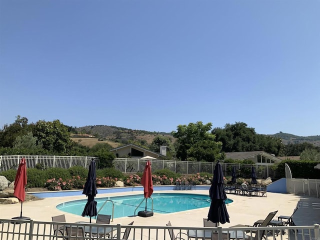 32688 Taspa Ct, Pauma Valley, CA 92061 - community pool with a patio area and a mountain view