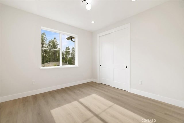 6638 Dolores Dr, Paradise, CA 95969 - unfurnished bedroom featuring light wood finished floors, a closet, and recessed lighting