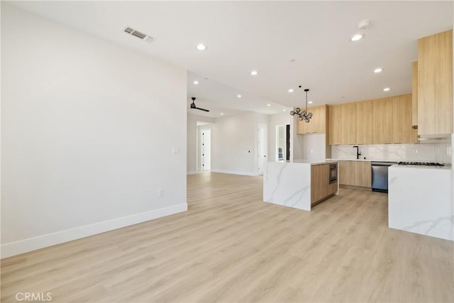 6638 Dolores Dr, Paradise, CA 95969 - kitchen with modern cabinets, recessed lighting, open floor plan, light brown cabinets, and light wood-type flooring