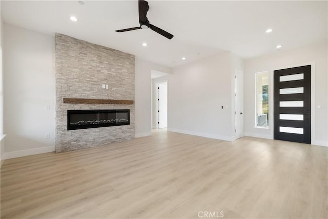6638 Dolores Dr, Paradise, CA 95969 - unfurnished living room with a ceiling fan, a fireplace, wood finished floors, and recessed lighting