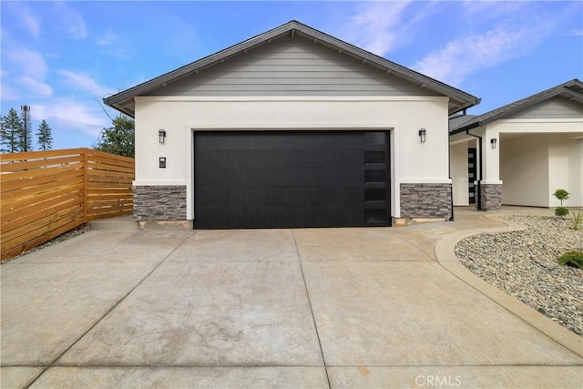 6638 Dolores Dr, Paradise, CA 95969 - view of front of home featuring stone siding, stucco siding, concrete driveway, and a garage