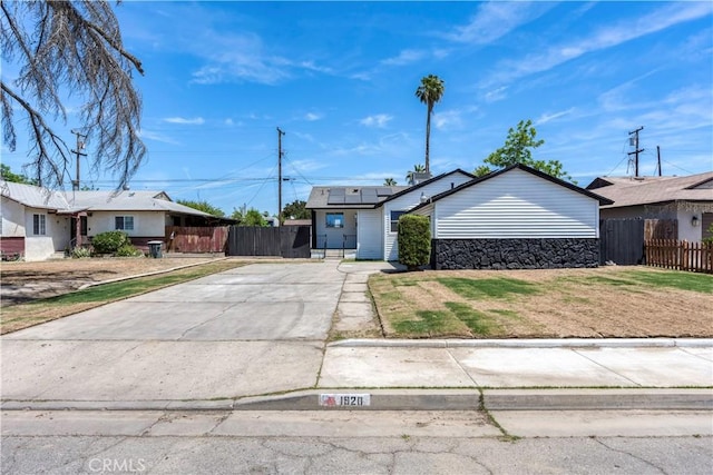 1920 Doolittle Ave, Bakersfield, CA 93304 - view of front of house with solar panels and driveway
