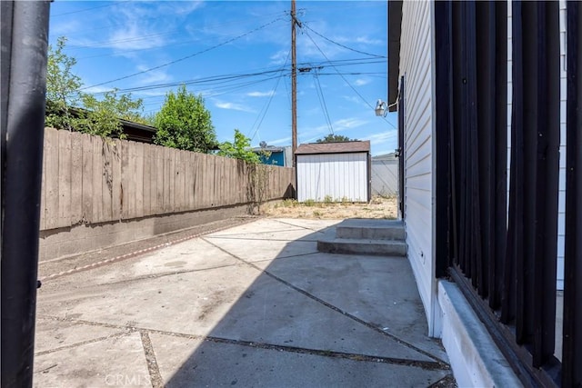 1920 Doolittle Ave, Bakersfield, CA 93304 - fenced backyard featuring a patio and a storage unit
