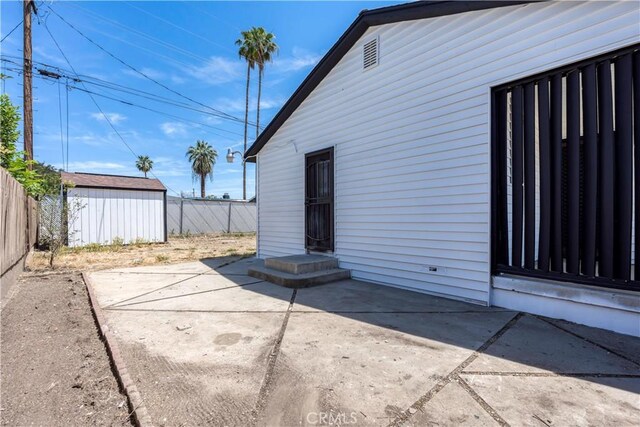 1920 Doolittle Ave, Bakersfield, CA 93304 - back of property with a patio area and an outbuilding