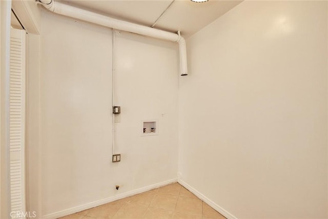856 N Van Ness Ave Unit 3, Los Angeles, CA 90038 - washroom with hookup for a washing machine and light tile patterned flooring