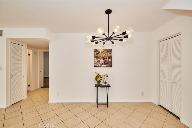 856 N Van Ness Ave Unit 3, Los Angeles, CA 90038 - unfurnished dining area featuring light tile patterned flooring and a chandelier