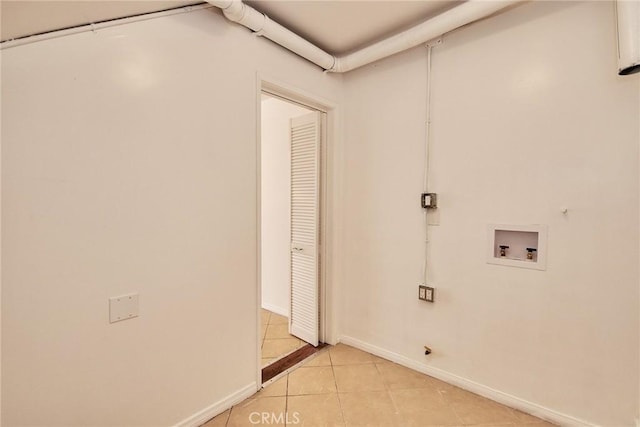 856 N Van Ness Ave Unit 3, Los Angeles, CA 90038 - washroom featuring washer hookup and light tile patterned floors