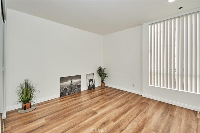 856 N Van Ness Ave Unit 3, Los Angeles, CA 90038 - unfurnished living room with wood finished floors and recessed lighting