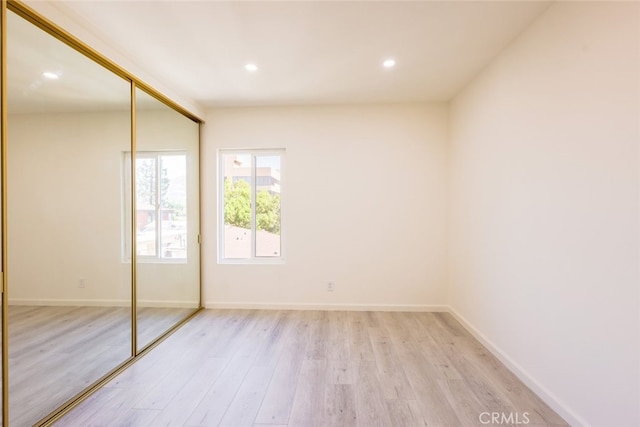 409 Burchett St Unit 311, Glendale, CA 91203 - unfurnished bedroom featuring light wood-style flooring, a closet, and recessed lighting