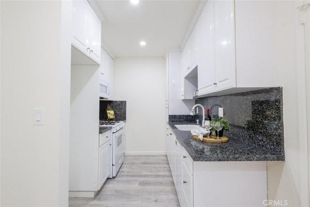 409 Burchett St Unit 311, Glendale, CA 91203 - kitchen with white appliances, white cabinetry, tasteful backsplash, light wood-style floors, and recessed lighting