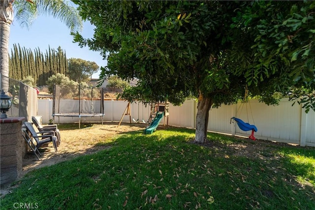 8873 Reche Canyon Rd, Colton, CA 92324 - fenced backyard featuring a trampoline and a playground