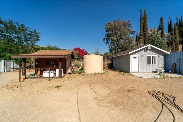 8873 Reche Canyon Rd, Colton, CA 92324 - view of yard featuring an outbuilding and an exterior structure