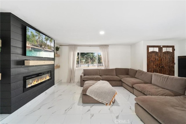 8873 Reche Canyon Rd, Colton, CA 92324 - living room with a glass covered fireplace, marble finish flooring, and recessed lighting